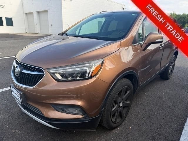 2017 Buick Encore Essence in Includes (Cm5) Black Carbon Metallic Lower Exterior Accent Color, Paint Code W700s.) — front three-quarter view